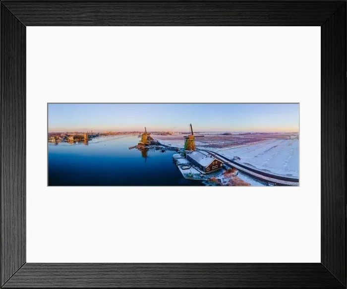 Framed Print : Zaanse Schans windmill village during winter with snow landscape in the Netherlands Holland village in winter Framed Print : Zaanse Schans windmill village during winter with snow landscape in the Netherlands Holland village in winter