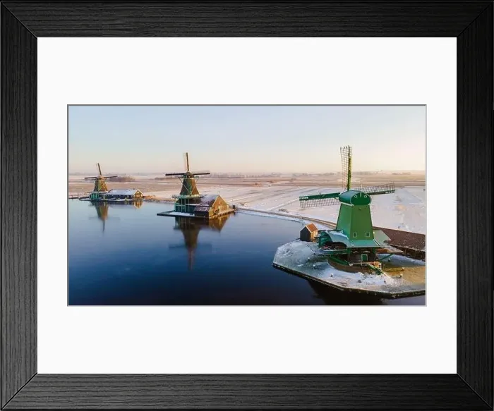 Framed Print : Zaanse Schans windmill village during winter with snow landscape in the Netherlands Holland village in winter Framed Print : Zaanse Schans windmill village during winter with snow landscape in the Netherlands Holland village in winter