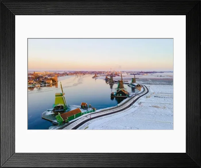 Framed Print : Zaanse Schans windmill village during winter with snow landscape in the Netherlands Holland village in winter Framed Print : Zaanse Schans windmill village during winter with snow landscape in the Netherlands Holland village in winter