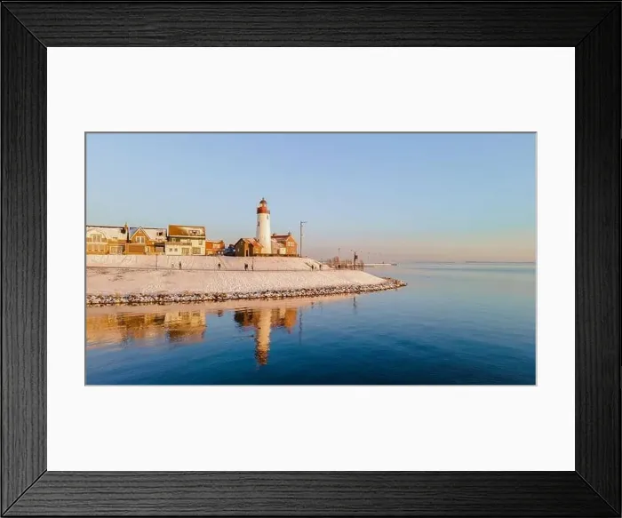 Framed Print : Lighthouse of Urk during winter with snow landscape in the Netherlands Framed Print : Lighthouse of Urk during winter with snow landscape in the Netherlands