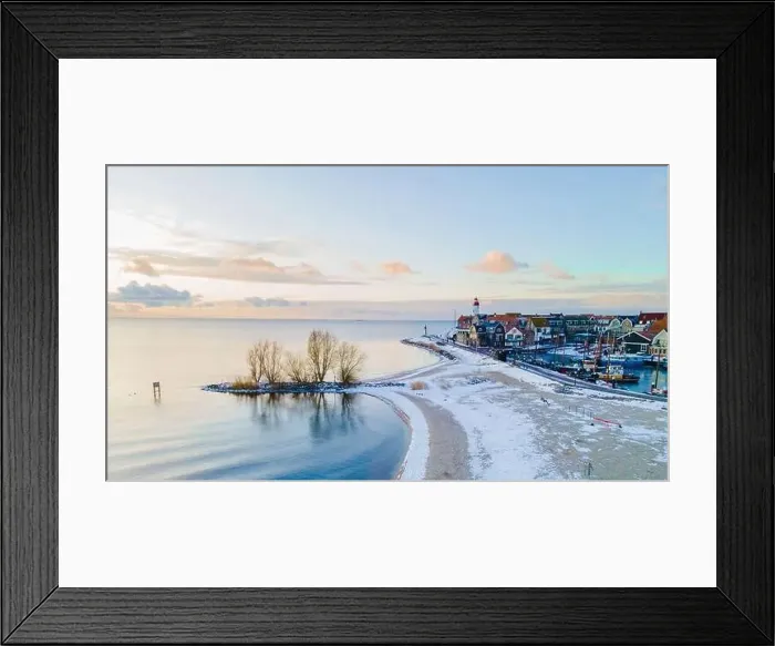Framed Print : Lighthouse of Urk during winter with snow landscape in the Netherlands Framed Print : Lighthouse of Urk during winter with snow landscape in the Netherlands