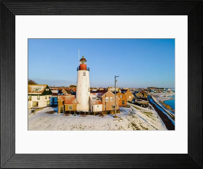 Framed Print : Urk lighthouse during winter with snow landscape in the Netherlands Framed Print : Urk lighthouse during winter with snow landscape in the Netherlands