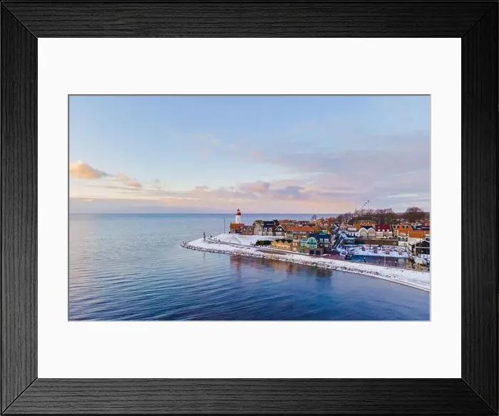 Framed Print : Lighthouse of Urk during winter with snow landscape in the Netherlands. Dutch old village Framed Print : Lighthouse of Urk during winter with snow landscape in the Netherlands. Dutch old village