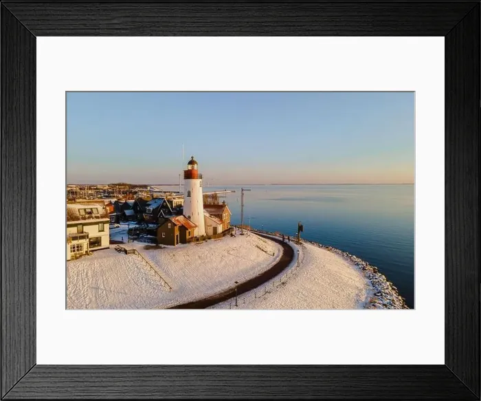 Framed Print : Lighthouse of Urk during winter with snow landscape in the Netherlands. Dutch village in winter Framed Print : Lighthouse of Urk during winter with snow landscape in the Netherlands. Dutch village in winter