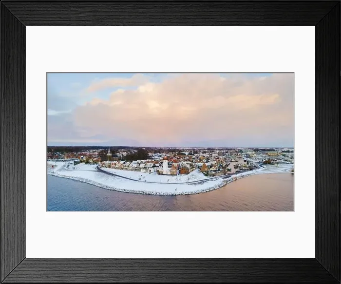 Framed Print : Lighthouse of Urk during winter with snow landscape in the Netherlands. Dutch village in winter Framed Print : Lighthouse of Urk during winter with snow landscape in the Netherlands. Dutch village in winter