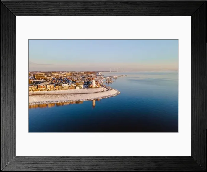 Framed Print : Lighthouse of Urk during winter with snow landscape in the Netherlands. Dutch village in winter with snow Framed Print : Lighthouse of Urk during winter with snow landscape in the Netherlands. Dutch village in winter with snow