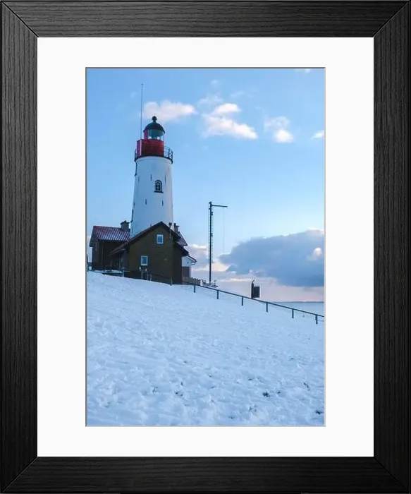 Framed Print : Lighthouse of Urk with snow landscape during winter in the Netherlands Framed Print : Lighthouse of Urk with snow landscape during winter in the Netherlands