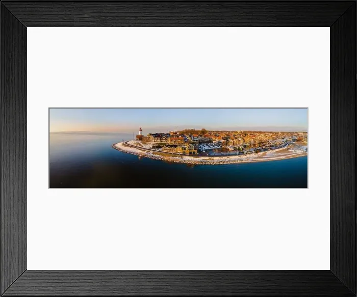 Framed Print : Lighthouse of Urk with snow landscape during winter in the Netherlands Framed Print : Lighthouse of Urk with snow landscape during winter in the Netherlands