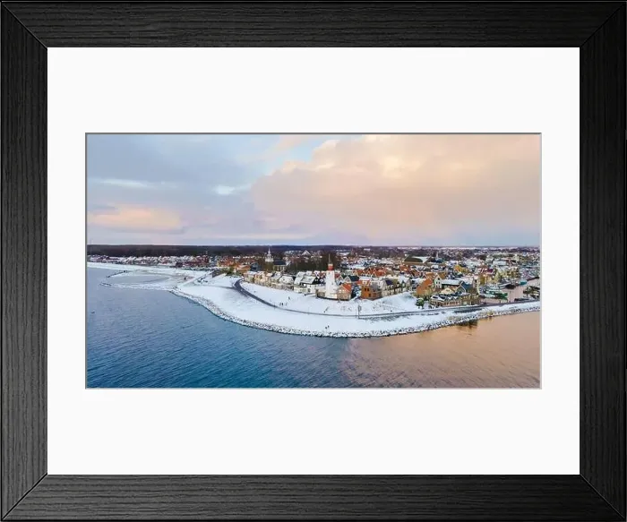 Framed Print : Drone view of the Lighthouse of Urk during winter with snow landscape in the Netherlands Framed Print : Drone view of the Lighthouse of Urk during winter with snow landscape in the Netherlands