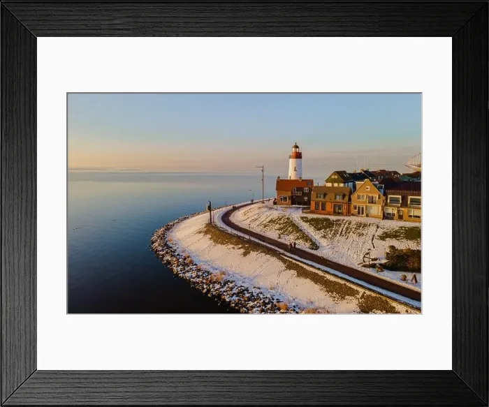 Framed Print : Lighthouse of Urk with snow landscape during winter in the Netherlands Framed Print : Lighthouse of Urk with snow landscape during winter in the Netherlands