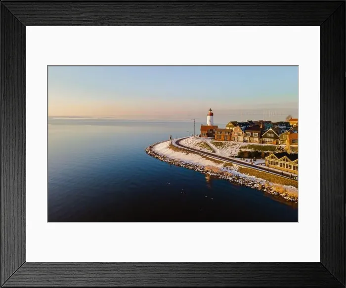 Framed Print : panoramic view of the Lighthouse of Urk during winter with snow landscape in the Netherlands Framed Print : panoramic view of the Lighthouse of Urk during winter with snow landscape in the Netherlands