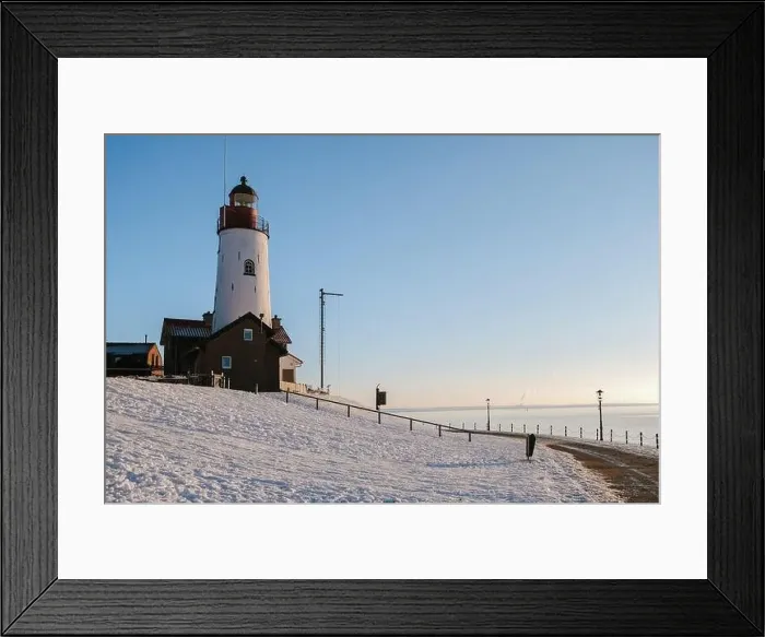Framed Print : Lighthouse of Urk during winter with snow landscape in the Netherlands on a sunny day Framed Print : Lighthouse of Urk during winter with snow landscape in the Netherlands on a sunny day