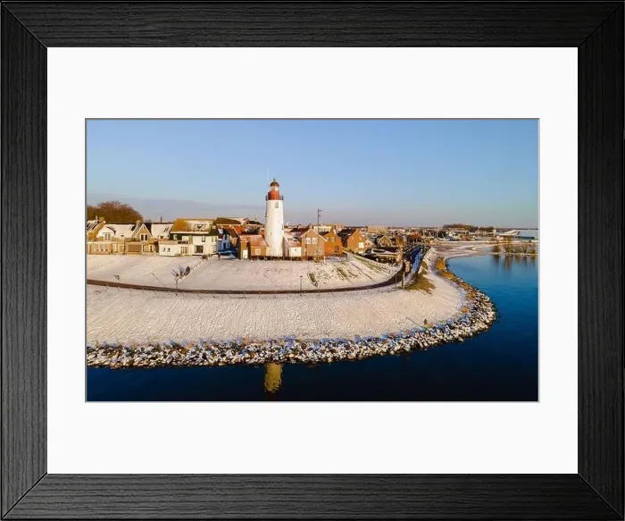 Framed Print : panoramic view of the Lighthouse of Urk during winter with snow landscape in the Netherlands Framed Print : panoramic view of the Lighthouse of Urk during winter with snow landscape in the Netherlands