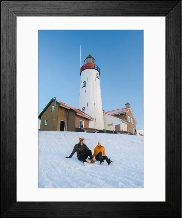 Framed Print : Lighthouse of Urk during winter with snow landscape in the Netherlands Framed Print : Lighthouse of Urk during winter with snow landscape in the Netherlands