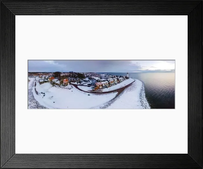 Framed Print : panoramic view of the Lighthouse of Urk during winter with snow landscape in the Netherlands Framed Print : panoramic view of the Lighthouse of Urk during winter with snow landscape in the Netherlands
