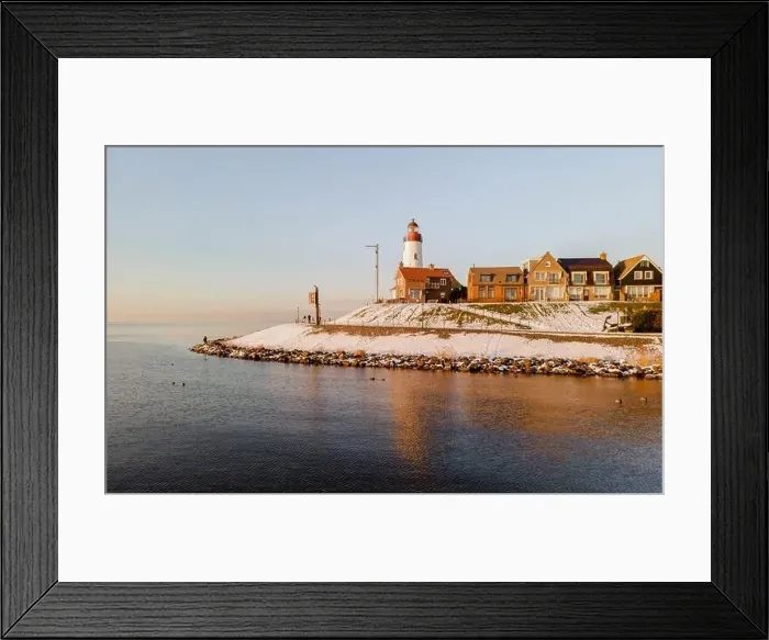 Framed Print : Lighthouse of Urk with snow landscape during winter in the Netherlands Framed Print : Lighthouse of Urk with snow landscape during winter in the Netherlands