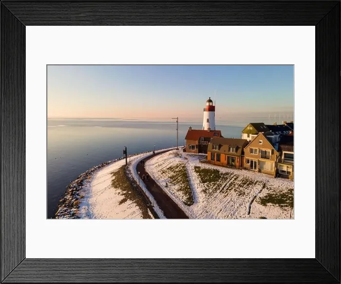 Framed Print : Urk lighthouse during winter with snow landscape in the Netherlands Framed Print : Urk lighthouse during winter with snow landscape in the Netherlands