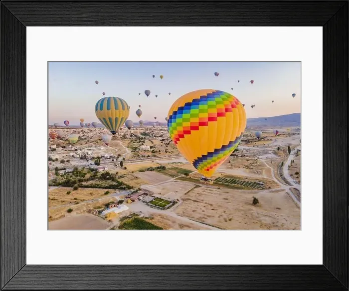 Framed Print : Colorful hot air balloons flying over at fairy chimneys valley in Nevsehir Framed Print : Colorful hot air balloons flying over at fairy chimneys valley in Nevsehir