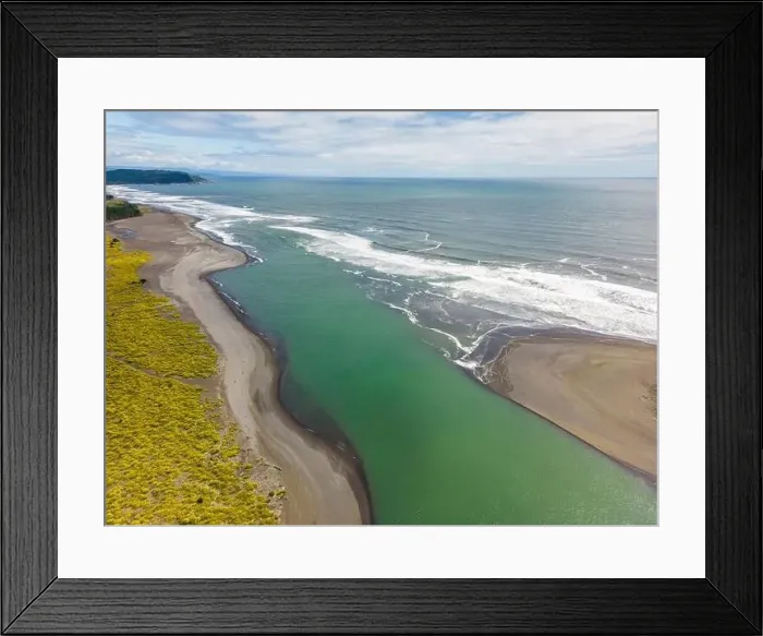 Framed Print : Aerial shot of the point where the river Tolten flows into the pacific ocean in Araucania, Chile Framed Print : Aerial shot of the point where the river Tolten flows into the pacific ocean in Araucania, Chile