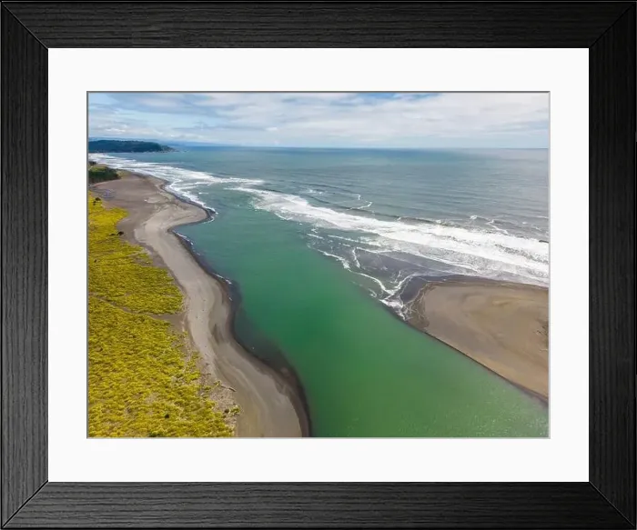 Framed Print : Aerial shot of the point where the river Tolten flows into the pacific ocean in Araucania, Chile Framed Print : Aerial shot of the point where the river Tolten flows into the pacific ocean in Araucania, Chile