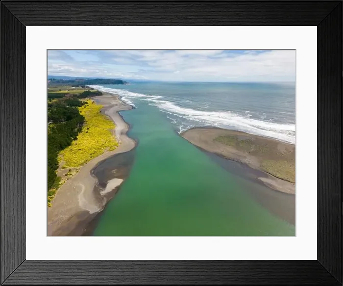 Framed Print : Aerial shot of the point where the river Tolten flows into the pacific ocean in Araucania, Chile Framed Print : Aerial shot of the point where the river Tolten flows into the pacific ocean in Araucania, Chile
