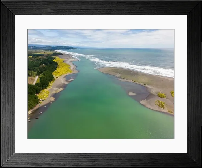 Framed Print : Aerial shot of the point where the river Tolten flows into the pacific ocean in Araucania, Chile Framed Print : Aerial shot of the point where the river Tolten flows into the pacific ocean in Araucania, Chile