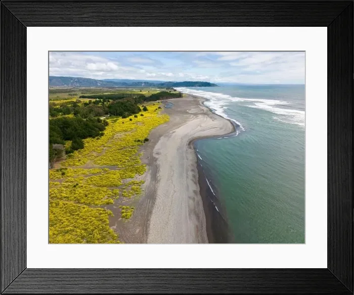 Framed Print : Aerial shot of the point where the river Tolten flows into the pacific ocean in Araucania, Chile Framed Print : Aerial shot of the point where the river Tolten flows into the pacific ocean in Araucania, Chile