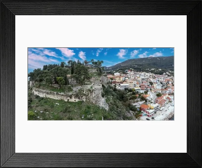 Framed Print : Parga city, Greece aerial drone view of Venetian Castle ruins, coastal traditional building cloudy blue sky background Framed Print : Parga city, Greece aerial drone view of Venetian Castle ruins, coastal traditional building cloudy blue sky background