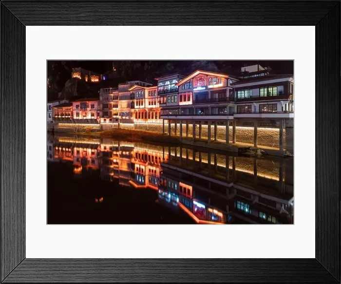 Framed Print : Amasya, Turkey - December 22, 2022 : Old Ottoman houses and clock tower view by the Yesilirmak River in Amasya City