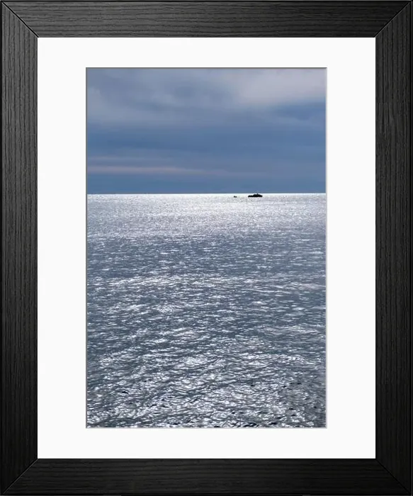 Framed Print : Blue cloudy sky and sea, aerial drone view. Small rocks in endless blue. Rippled ocean water, silver reflections Framed Print : Blue cloudy sky and sea, aerial drone view. Small rocks in endless blue. Rippled ocean water, silver reflections