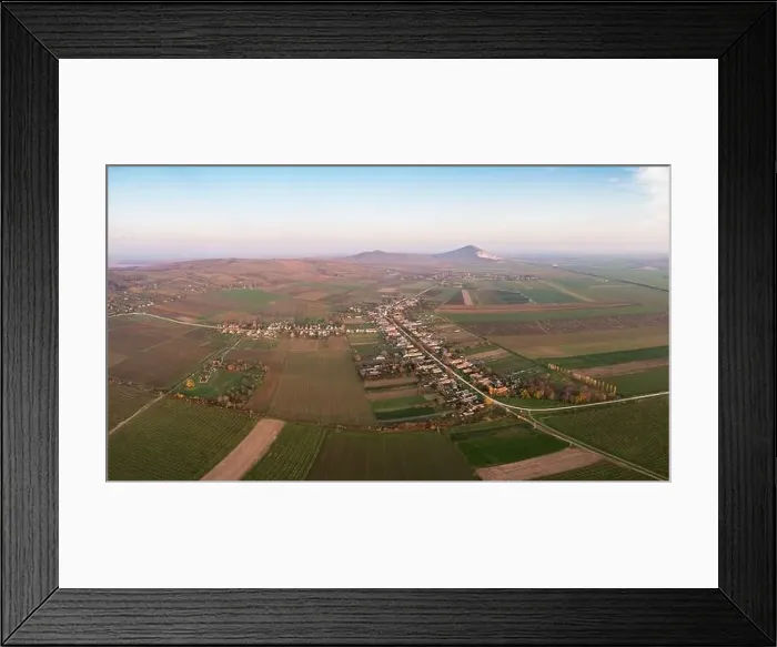 Framed Print : Aerial view of Szarsomlyo mountain with small village in Hungary