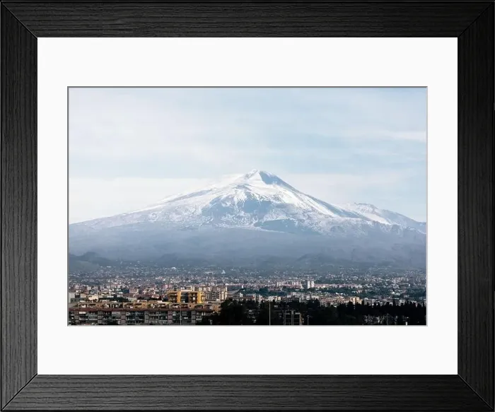 Framed Print : Breathtaking drone view of Mont Etna with snowy peak located near Catania city on cloudy day in Sicily, Italy Framed Print : Breathtaking drone view of Mont Etna with snowy peak located near Catania city on cloudy day in Sicily, Italy