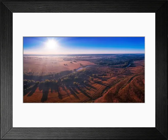 Framed Print : The channel and bends of the river, on a marshy meadow. Orange dry grass, scorched by the summer heat, and morning fog Framed Print : The channel and bends of the river, on a marshy meadow. Orange dry grass, scorched by the summer heat, and morning fog