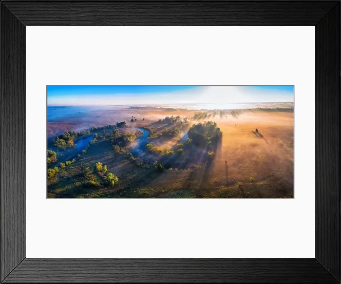 Framed Print : The channel and bends of the river, on a marshy meadow. Orange dry grass, scorched by the summer heat, and morning fog Framed Print : The channel and bends of the river, on a marshy meadow. Orange dry grass, scorched by the summer heat, and morning fog