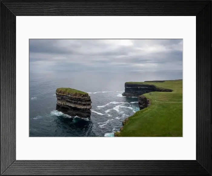 Framed Print : Aerial view of the Downpatrick Head sea stack and cliffs and coastline of northern County Mayo in Ireland