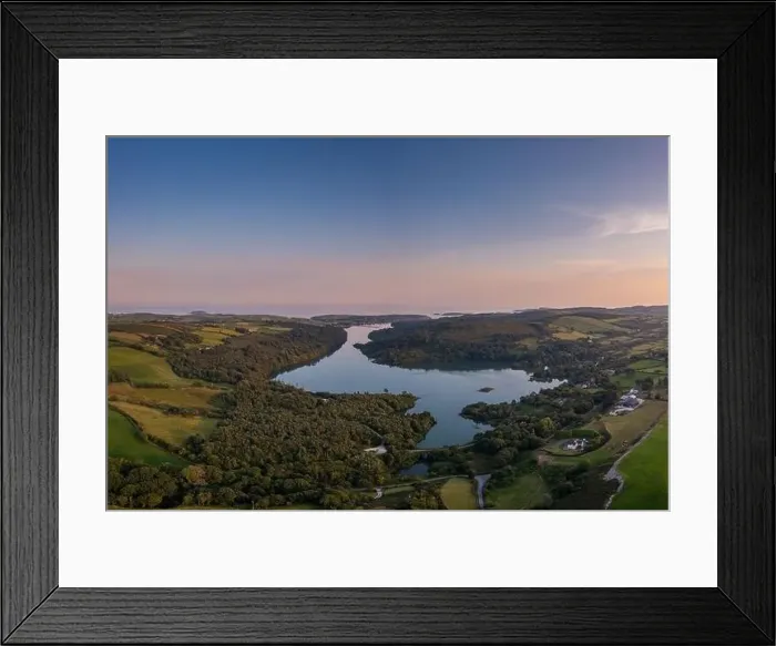 Framed Print : View of Castlehaven Bay and Rineen Woods in West Cork in warm evening light Framed Print : View of Castlehaven Bay and Rineen Woods in West Cork in warm evening light