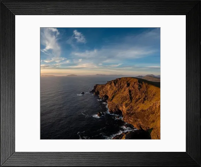 Framed Print : Sunset over the Atlantic Ocean and the cliffs of Bray Head on Valentia Island in County Kerry