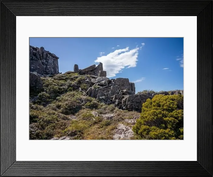 Framed Print : man hiking up a mountain with a backpack, alpine wilderness