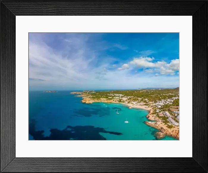 Framed Print : Aerial drone view of a beautiful coast and sea in Cala Tarida, Ibiza island, Spain Framed Print : Aerial drone view of a beautiful coast and sea in Cala Tarida, Ibiza island, Spain