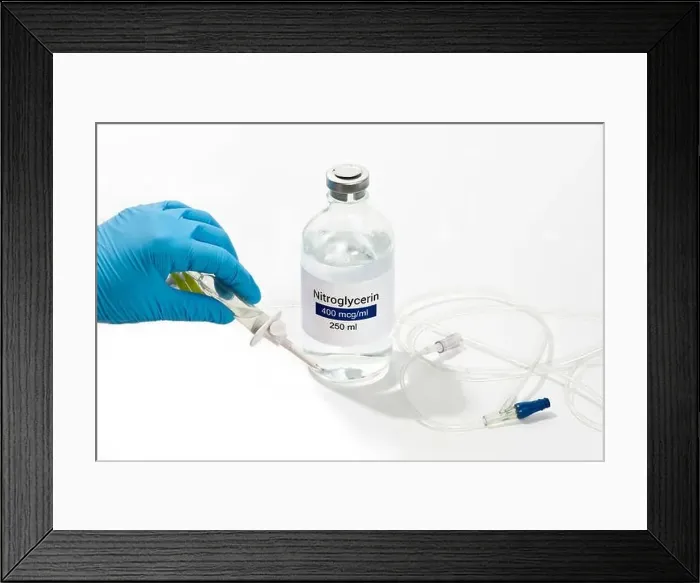 Framed Print : Nurse prepares IV solution of nitroglycerin for infusion