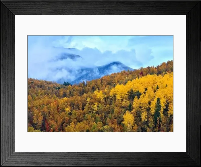 Framed Print : Aerial view of picturesque landscape with autumn forest and mountain range under cloudy sky Framed Print : Aerial view of picturesque landscape with autumn forest and mountain range under cloudy sky