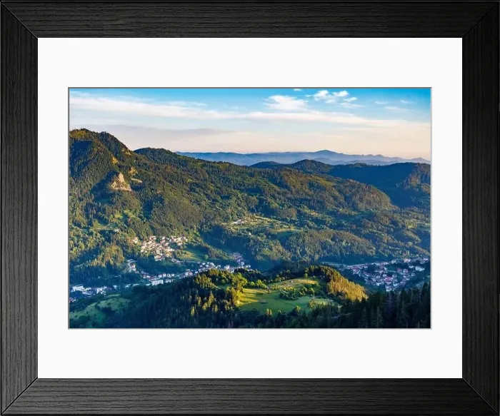 Framed Print : View from high rock to old village Smolyan with green meadows for cattle walking and houses Framed Print : View from high rock to old village Smolyan with green meadows for cattle walking and houses