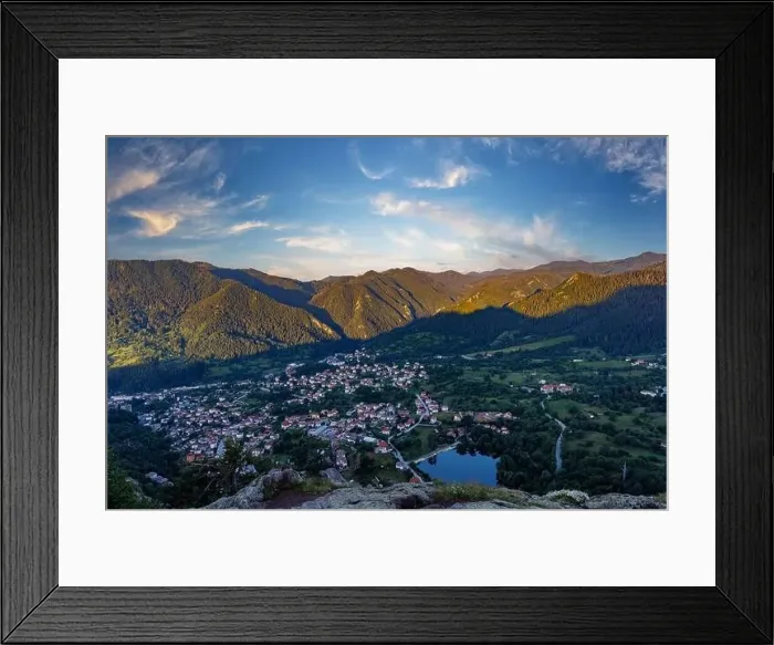 Framed Print : View from high rock to old village Smolyan with green meadows for cattle walking and houses Framed Print : View from high rock to old village Smolyan with green meadows for cattle walking and houses