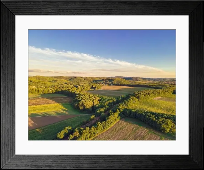 Framed Print : Drone footage of hills, fields and a railway line running through the trees, Balassagyarmat, Hungary Framed Print : Drone footage of hills, fields and a railway line running through the trees, Balassagyarmat, Hungary