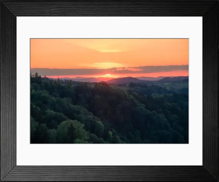 Framed Print : Setting sun behind clouds