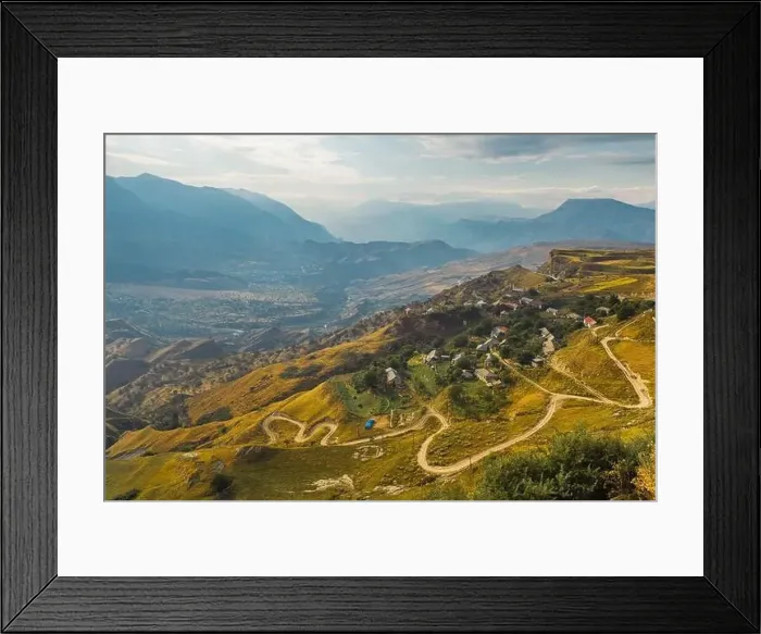 Framed Print : Winding road in the Dagestan Mountains with big mountain formation in the background Framed Print : Winding road in the Dagestan Mountains with big mountain formation in the background
