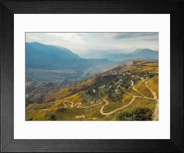 Framed Print : Winding road in the Dagestan Mountains with big mountain formation in the background Framed Print : Winding road in the Dagestan Mountains with big mountain formation in the background