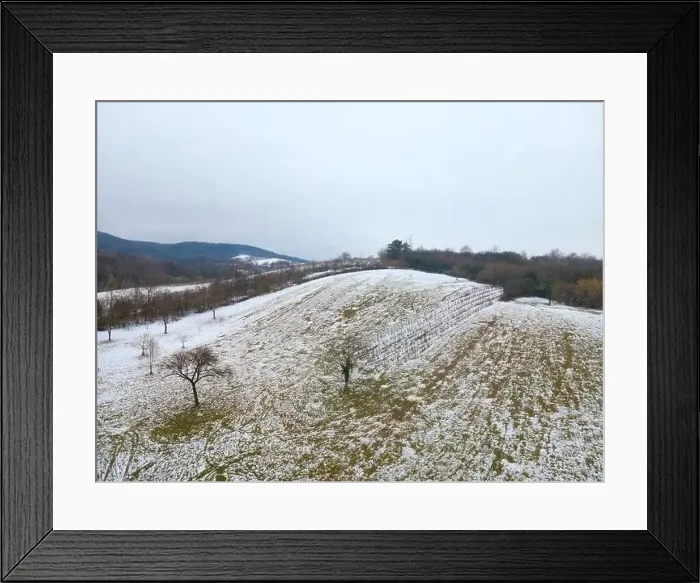 Framed Print : drone flight over landscape with very little snow