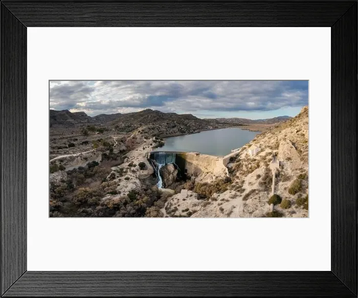 Framed Print : A drone view of the Elche Reservoir and dam wall with waterfall and surrounding semi-desert landscape Framed Print : A drone view of the Elche Reservoir and dam wall with waterfall and surrounding semi-desert landscape