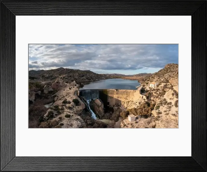 Framed Print : A drone view of the Elche Reservoir and dam wall with waterfall and surrounding semi-desert landscape Framed Print : A drone view of the Elche Reservoir and dam wall with waterfall and surrounding semi-desert landscape